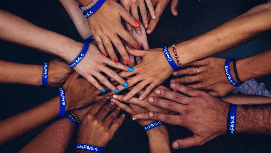 Image of hands forming a wheel from programme website