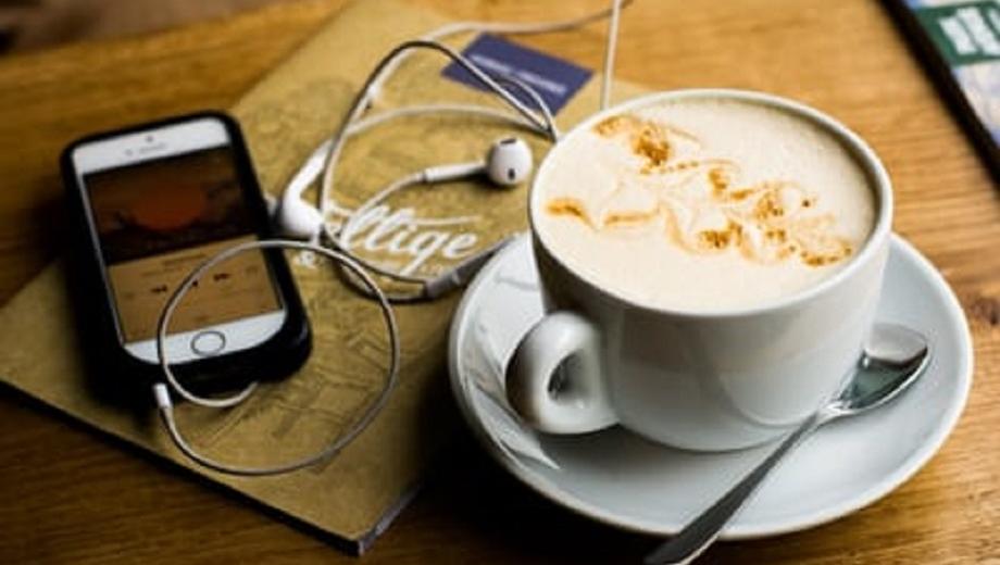 Photo of mobile phone and coffee. Credit: Juja Han